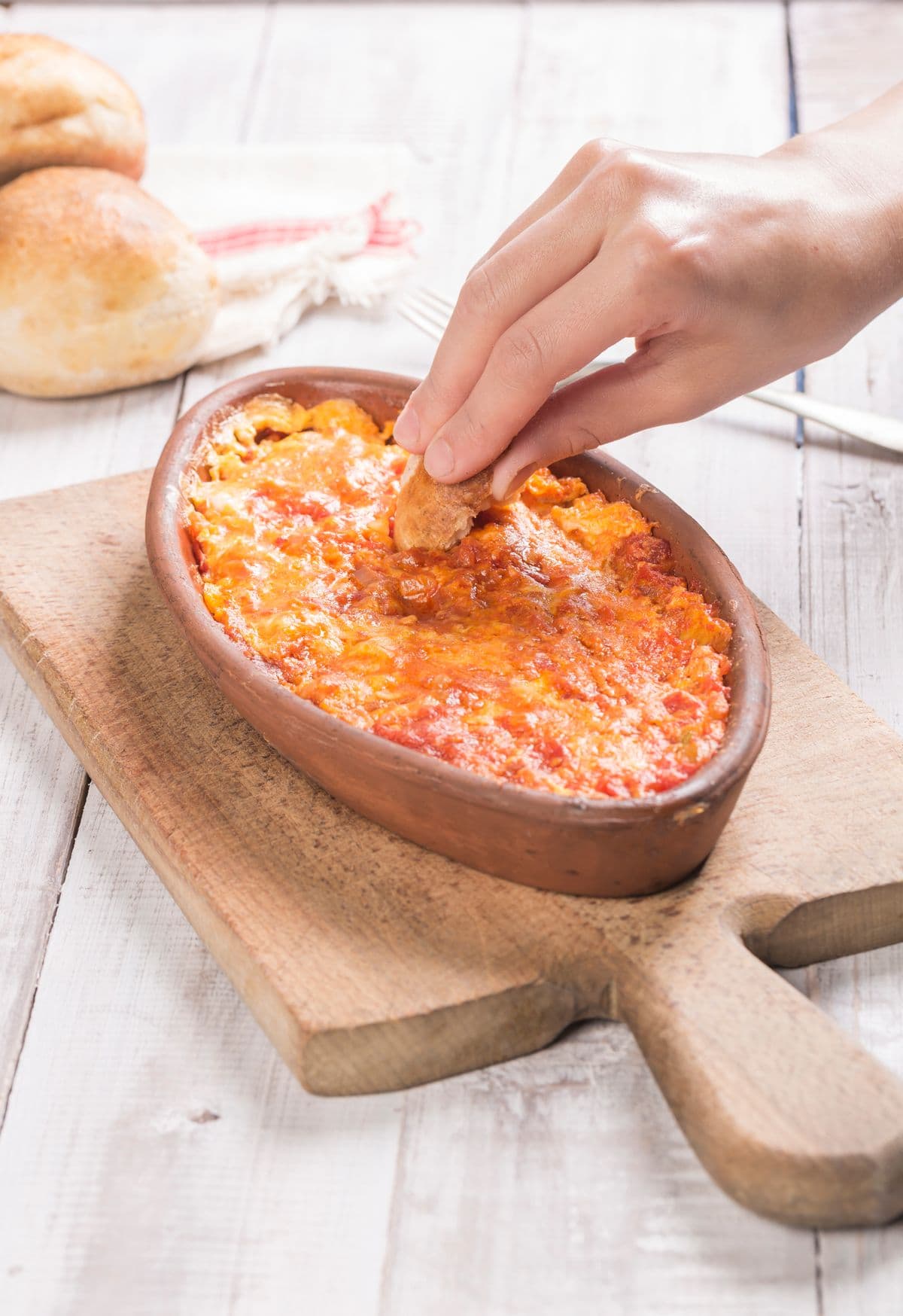 Menemen in a pan with bread, as a serving illustration