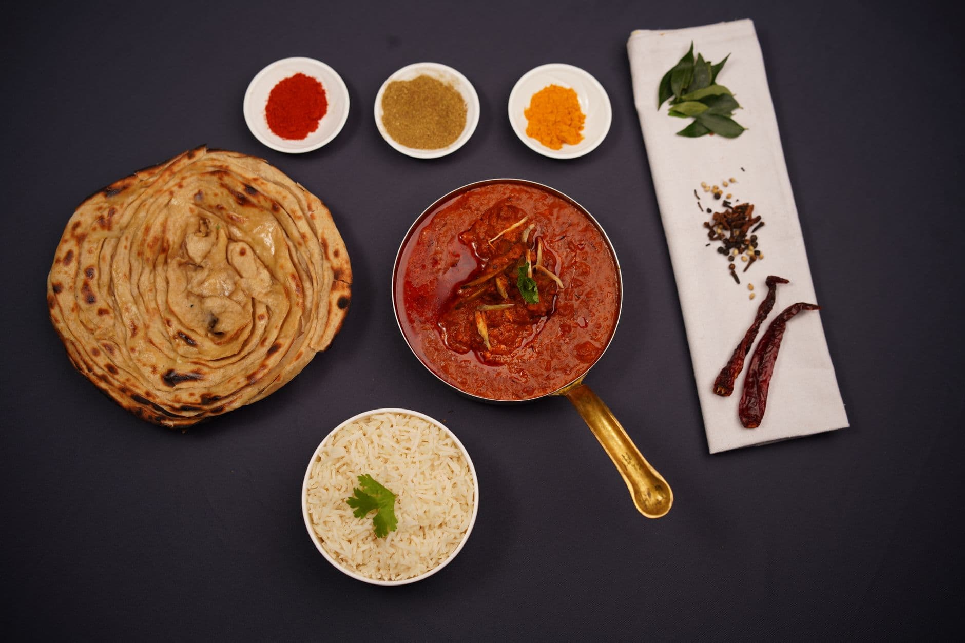 Spiced chicken tikka served with herbs and yogurt sauce