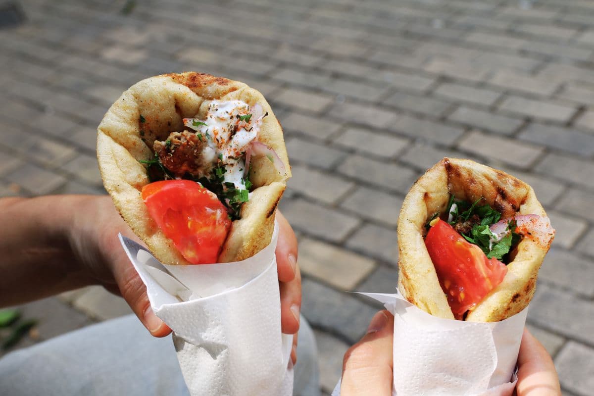 Gyro-style pitas with tomatoes and herbs, as a serving illustration