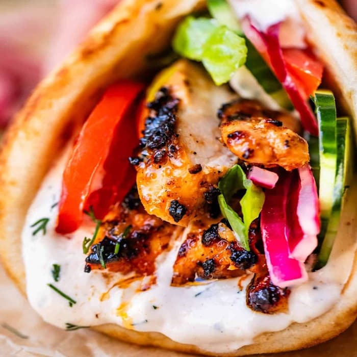 Chicken Shawarma with homemade garlic herb yoghurt sauce prepared and served as the finished dish