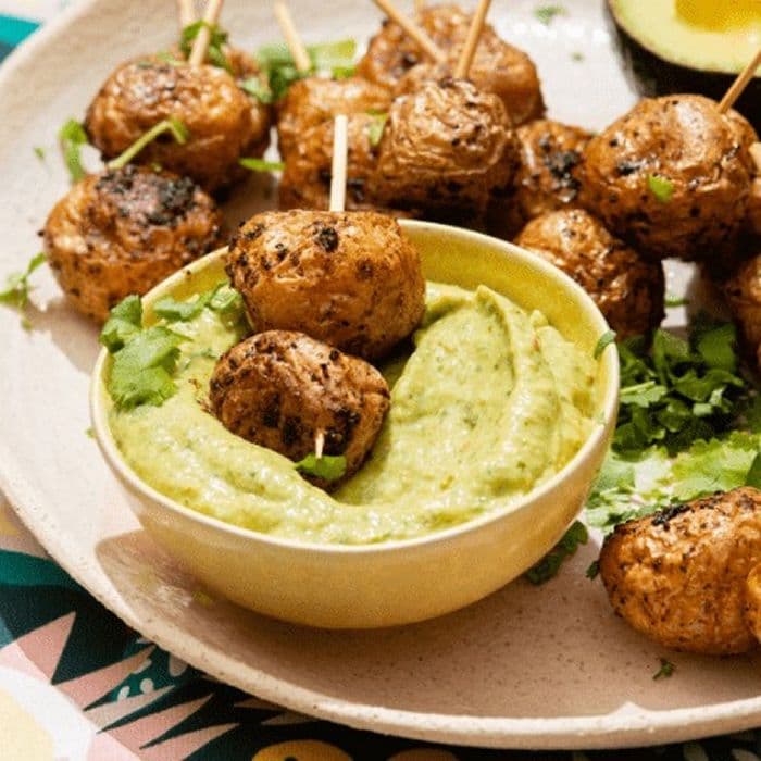 Avocado Dip with New Potatoes prepared and served as the finished dish