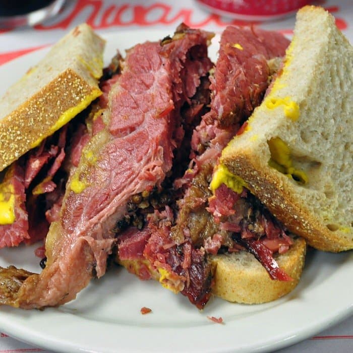 Montreal smoked meat sliced from a cured, smoked, and steam-finished beef brisket