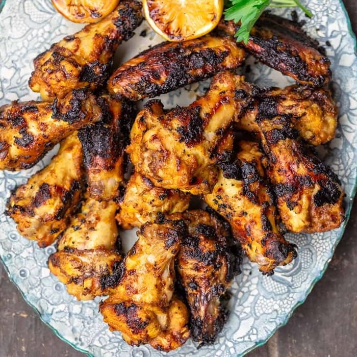 Chicken wings with cumin, lemon & garlic prepared and served as the finished dish